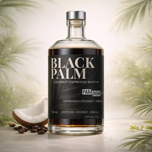 A bottle of Black Palm coconut espresso martini with coffee beans and coconut